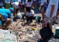 Voluntários recolhem 400 kg de lixo na praia da Barra